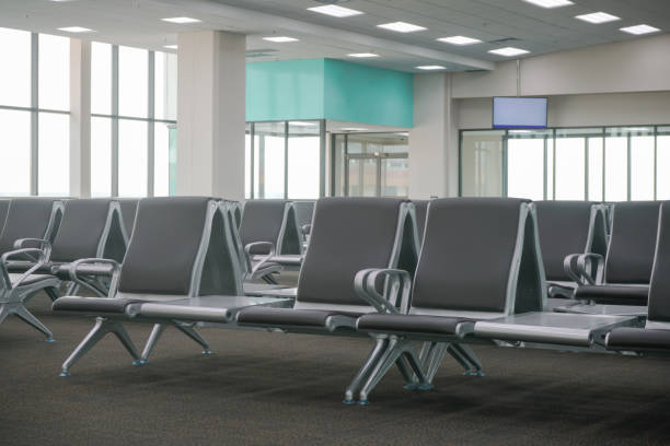 istock waiting area at airport terminal with empty chairs 836398268