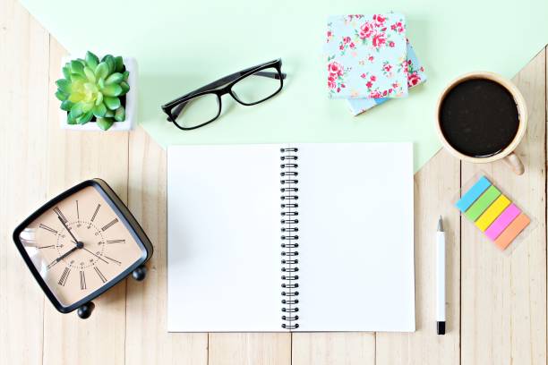 istock Office desk table with open notebook paper, accessories and coffee cup, Top view or flat lay with copy space ready for adding or mock up 836398492