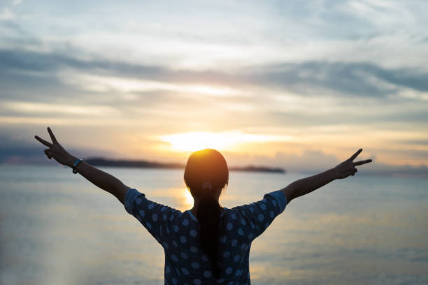 istock woman relax silhouette sea 836402974