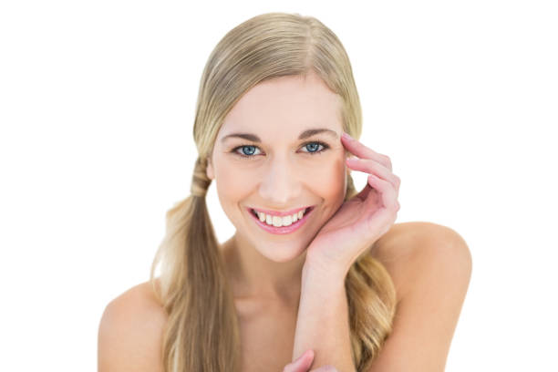 istock Joyful young blonde model posing holding her head 836409678