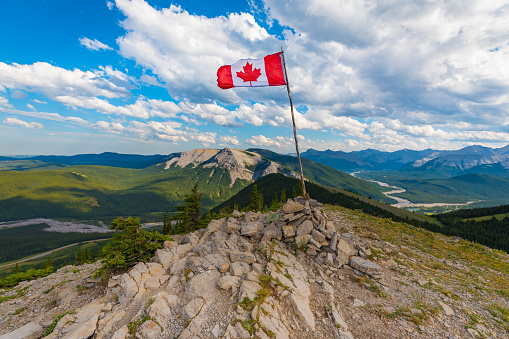 Canadian Flag on top of Sunrise Hill and in Kananaskis Country Alberta Canada