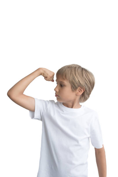 istock Boy showing his hand biceps muscles strength, isolated on white background. 836414190