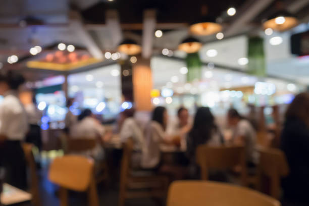 People in restaurant cafe interior with bokeh light blurred customer abstract background People in restaurant cafe or coffee shop interior with bokeh light blurred customer abstract business background, for create montage product display template busy restaurant tables stock pictures, royalty-free photos & images