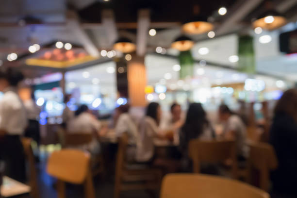 people in restaurant cafe interior with bokeh light blurred customer abstract background - food shopping imagens e fotografias de stock