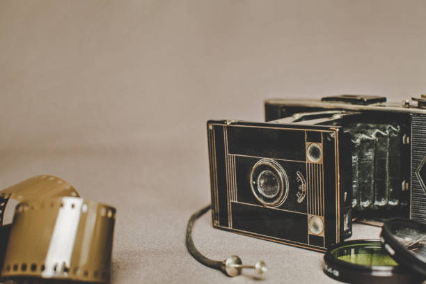 istock Old vintage retro camera still life on fabric background close up 836418576