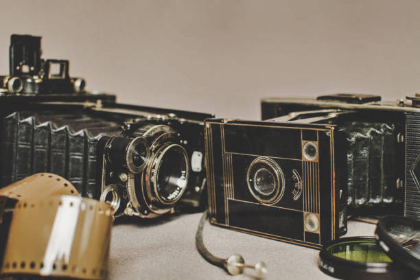 istock Old vintage retro camera still life on fabric background close up 836418582
