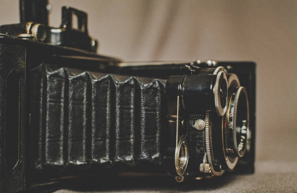 istock Old vintage retro camera still life on fabric background close up 836418794