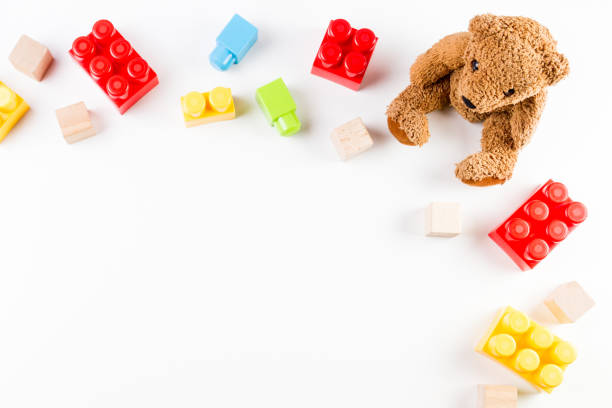 istock Kids toys background with teddy bear and colorful bricks 836423038