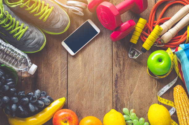 istock fitness concept with Exercise Equipment on wooden background. 836429908