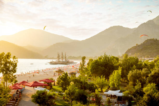 Paragliding in Oludeniz, Turkey Paragliding in Oludeniz, Turkey alanya stock pictures, royalty-free photos & images