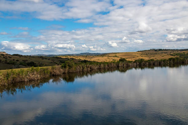 istock Dam Reflecting Blue Cloudy Winter Sky in Country Landscape 836433958