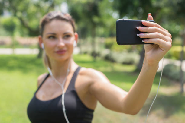 istock Woman jogger taking a selfie on morning run 836434210