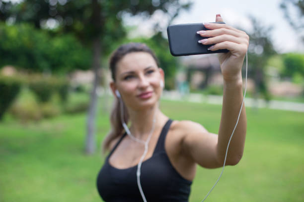 istock Woman jogger taking a selfie on morning run 836434330