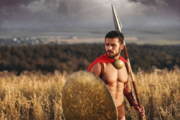 istock Muscular medieval warrior standing in the field 836434592