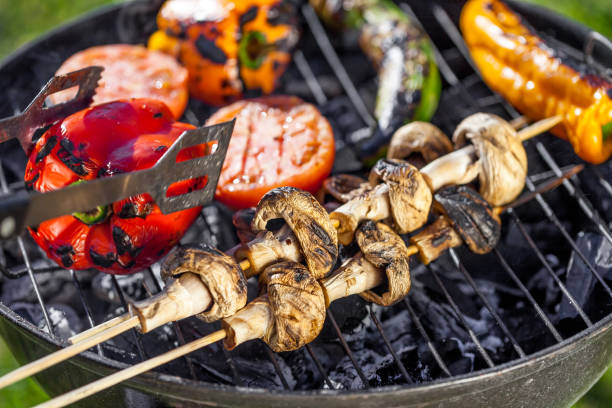 american barbecue - preparing bbq vegetables on charcoal grill