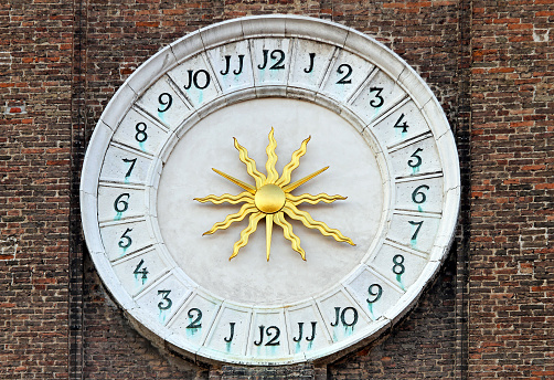 Medieval time 24 hours clock with golden sun
