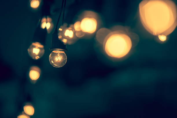 istock Retro light bulb hanging with dark space background for your decoration, concept of creativity - vintage color filter 836438736