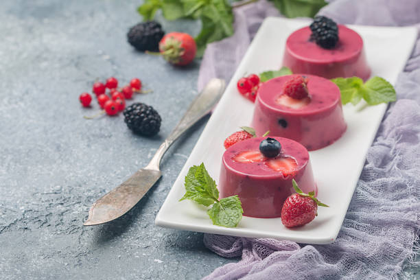 Summer dessert with berries Summer dessert with berries and yogurt as a jelly pudding tremoctopus gelatus stock pictures, royalty-free photos & images