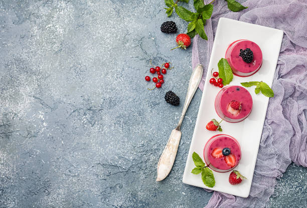 Summer dessert with berries Summer dessert with berries and yogurt as a jelly pudding tremoctopus gelatus stock pictures, royalty-free photos & images