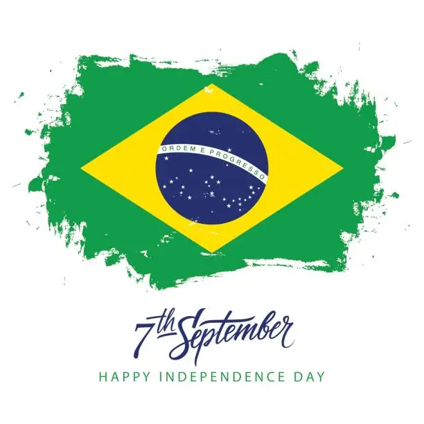 Vector illustration of Brazil Independence Day, 7 september greeting card with hand lettering and brazilian national flag brush stroke background.