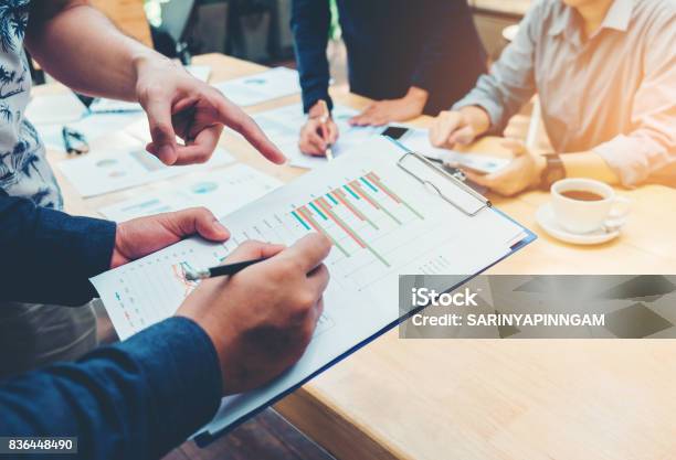 Start Up Business Team Colleagues Meeting Planning Strategy Analysis Discussing New Plan Financial On Graph Data New Business Project Stock Photo - Download Image Now