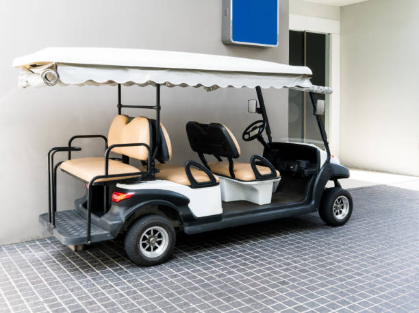 istock White golf cart with back seats in the public building 836449546