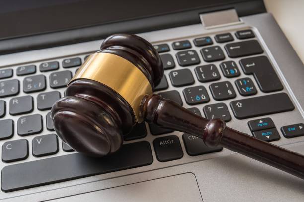 istock Close up view on gavel and computer keyboard. Internet security laws concept. 836450630