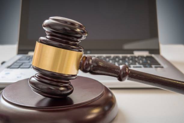 istock Gavel and laptop in background. Internet security and laws concept. 836450660