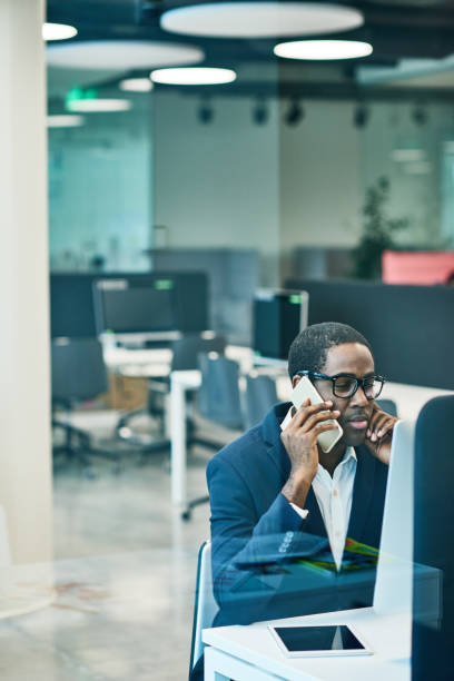 istock Busy African manager on phone 836450758