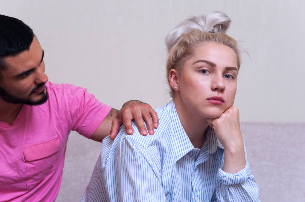 istock Young couple sitting on the couch after quarrel 836460388