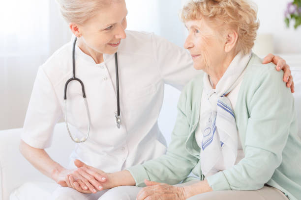 istock Caregiver is comforting an older lady 836461396