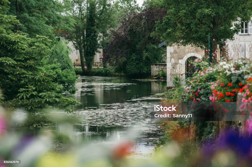 lake in the city of Chablis A lake in the city of Chablis, a view of the city park. Chablis - Region of France Stock Photo