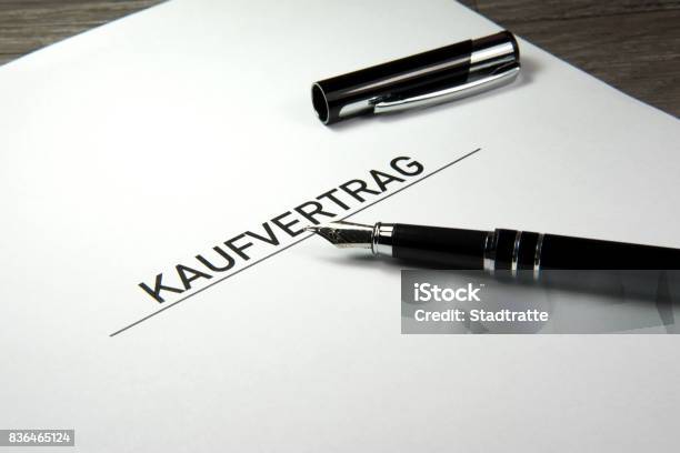 A Purchase Contract And An Elegant Fountain Pen Stock Photo - Download Image Now - Buying, Contract, Document