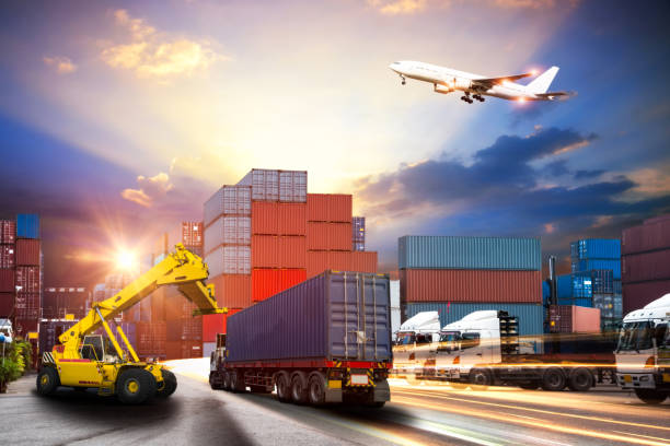 istock forklift handling container box loading to truck in import export logistic, Business logistics concept 836469354