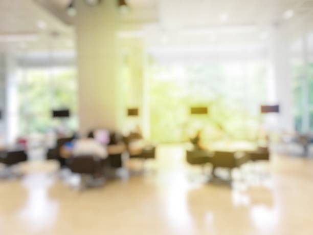 istock Blurred image of people reading, searching for books and preparing for the final examination with table desk and showing data with monitor display in library at university. abstract blur defocused. 836469534
