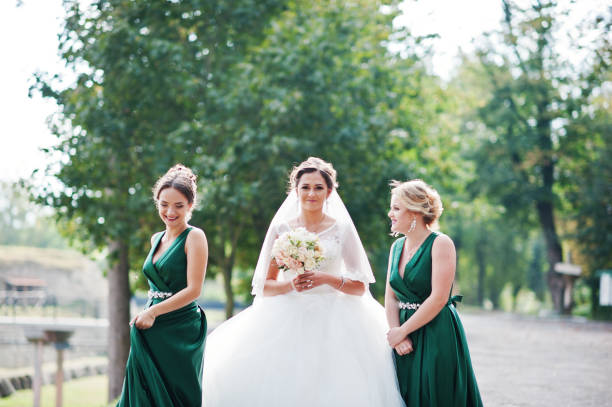 istock Fabulous bride walking, posing and having fun with her bridesmaids in the downtown on a wedding day. 836469596