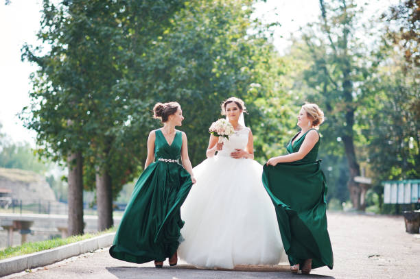 istock Fabulous bride walking, posing and having fun with her bridesmaids in the downtown on a wedding day. 836469606