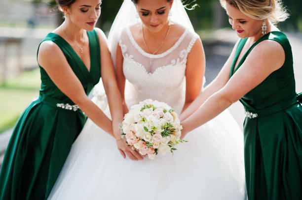 istock Fabulous bride walking, posing and having fun with her bridesmaids in the downtown on a wedding day. 836469702