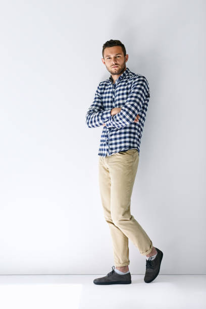 istock Confident handsome man with arms crossed on white wall background 836474178