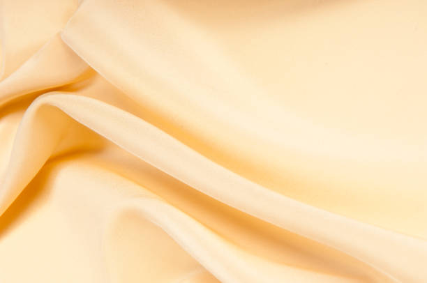 istock satin fabric texture. beige color. 836478390