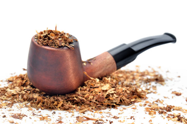Smoking pipe and tobacco isolated on white background Smoking pipe and tobacco isolated on white background. nicotiana rustica stock pictures, royalty-free photos & images