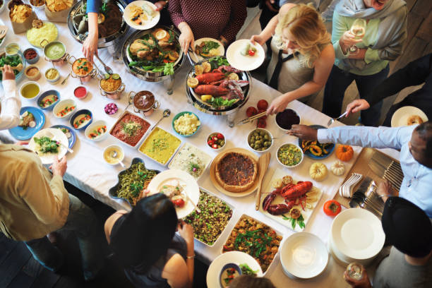 istock Diverse people having food together 836485508