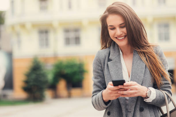 istock Woman texting in the city 836486612