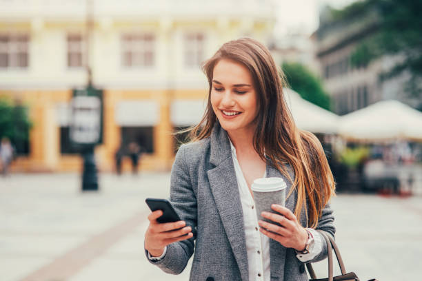 istock Woman texting in the city 836486616