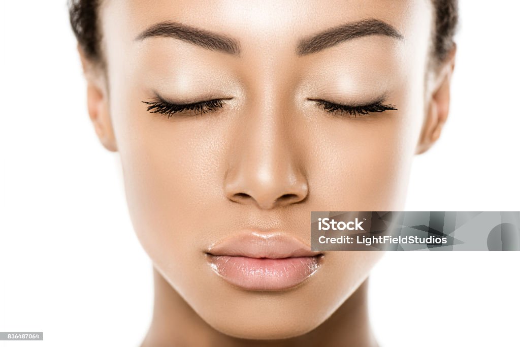 beautiful african american woman portrait of beautiful african american woman with eyes closed isolated on white Women Stock Photo