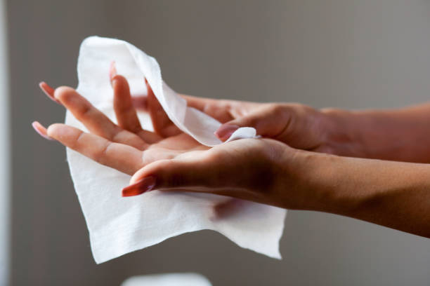 istock Hand with long nails clean with wet wipes 836490316
