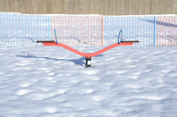 Snow running of a disused slide at a playground.