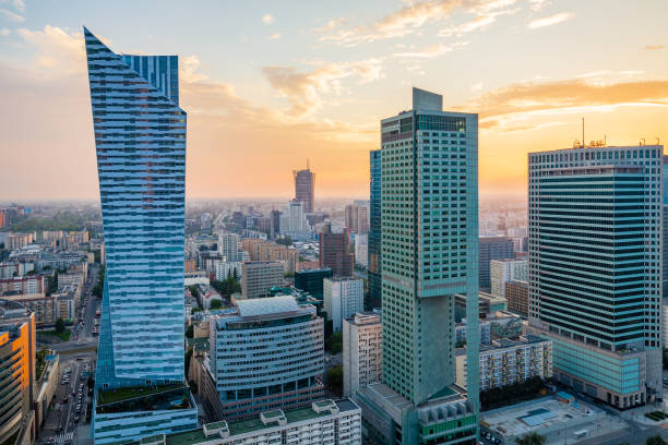 istock Warsaw downtown skyscrapers during beautiful sunset with impressive orange sky. 836491770