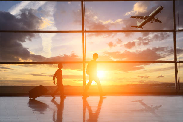 istock Airport interior child travel silhouette sunset 836494154