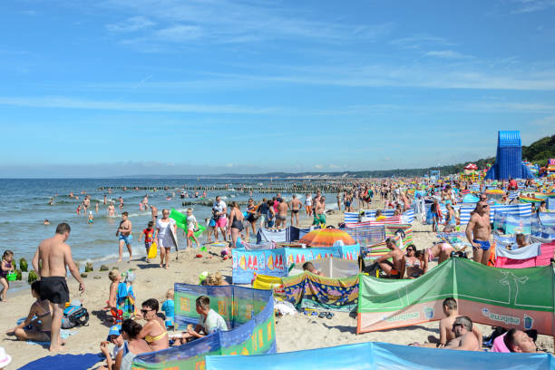 Ustka, Poland - August 02, 2017: People lounging in the high season at the beach in Ustka - known tourist resort on the Baltic sea in Poland